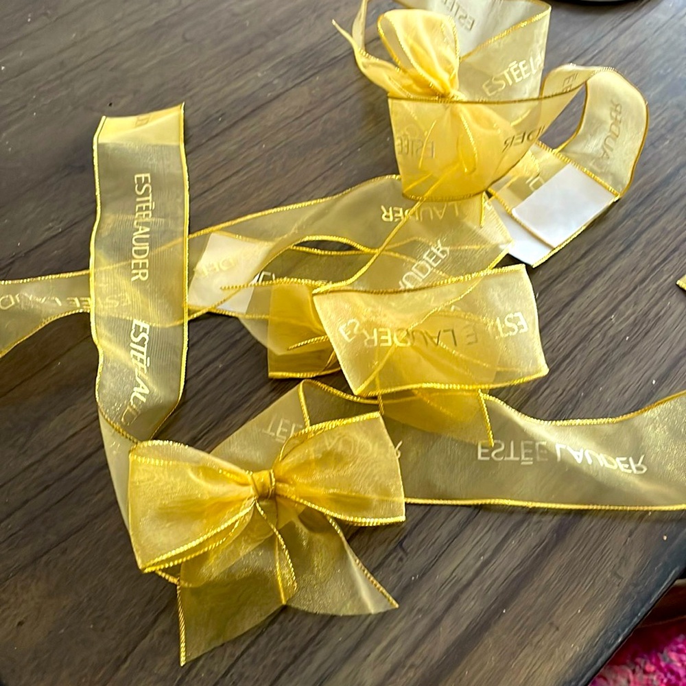 Vintage Estée Lauder gold bows